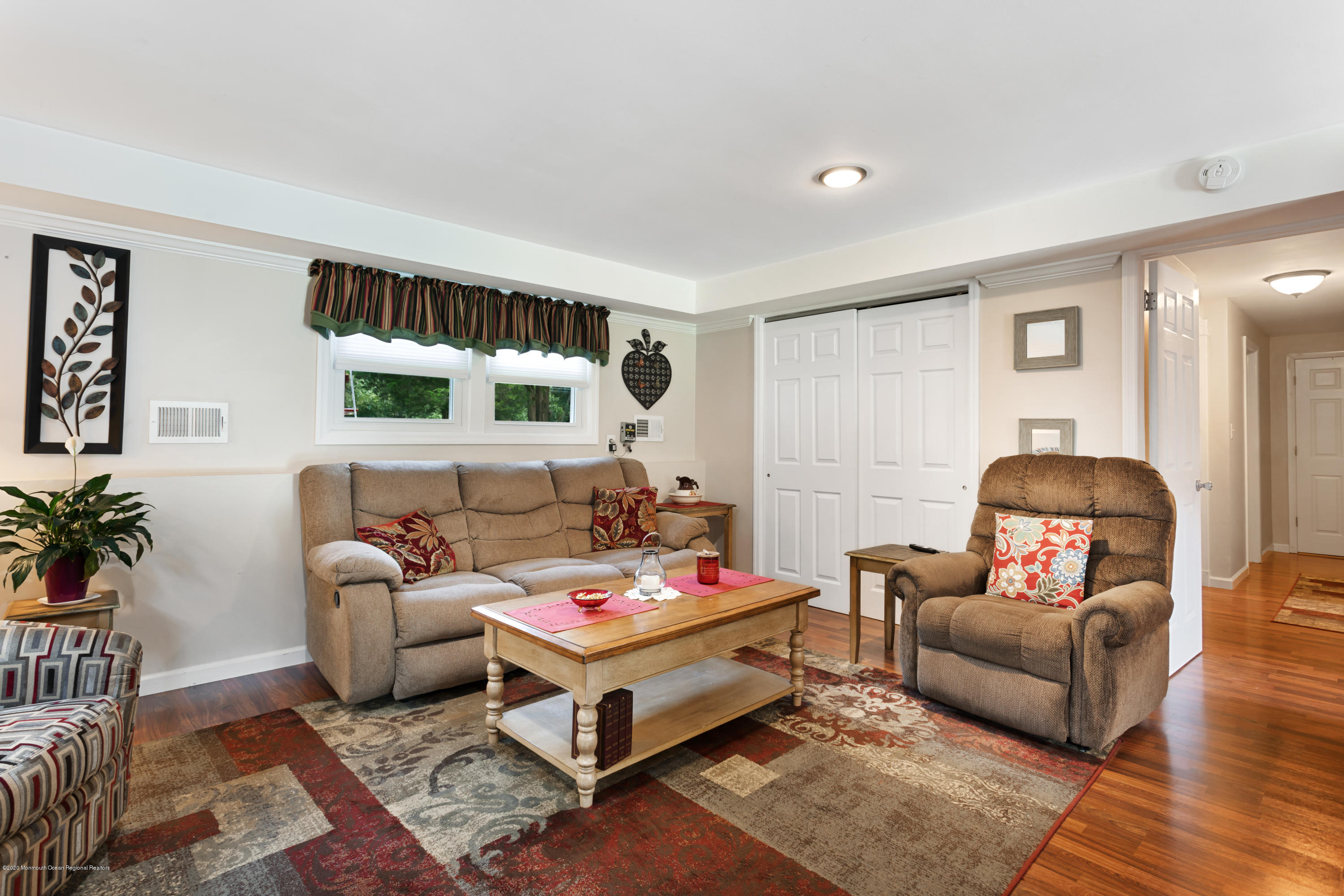 77 East Pleasant Grove Road Jackson, NJ 08527 - Photo 18 of 29 a living room with furniture and window