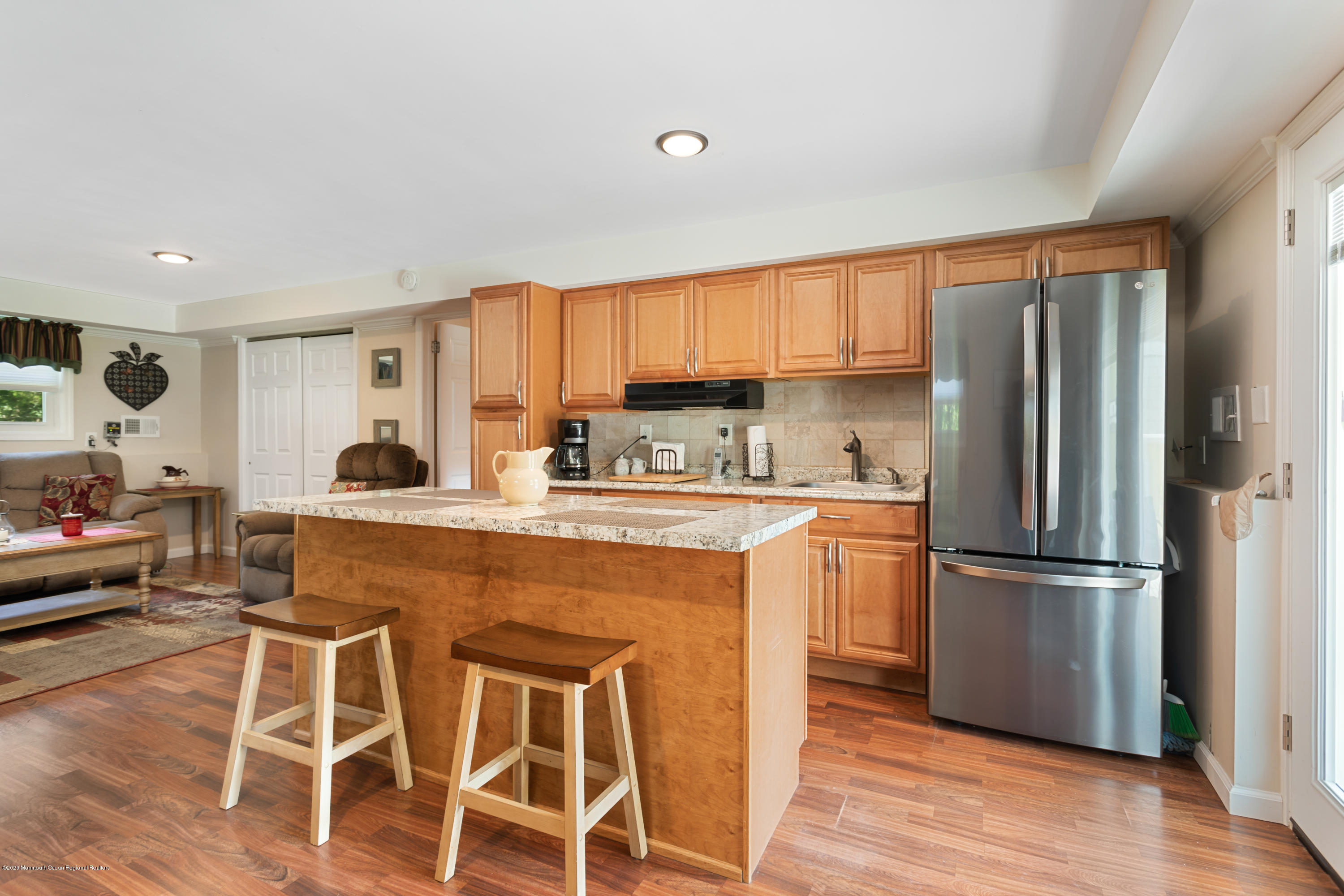 77 East Pleasant Grove Road Jackson, NJ 08527 - Photo 19 of 29 a kitchen with stainless steel appliances granite countertop a refrigerator a stove a sink and white cabinets with wooden floor