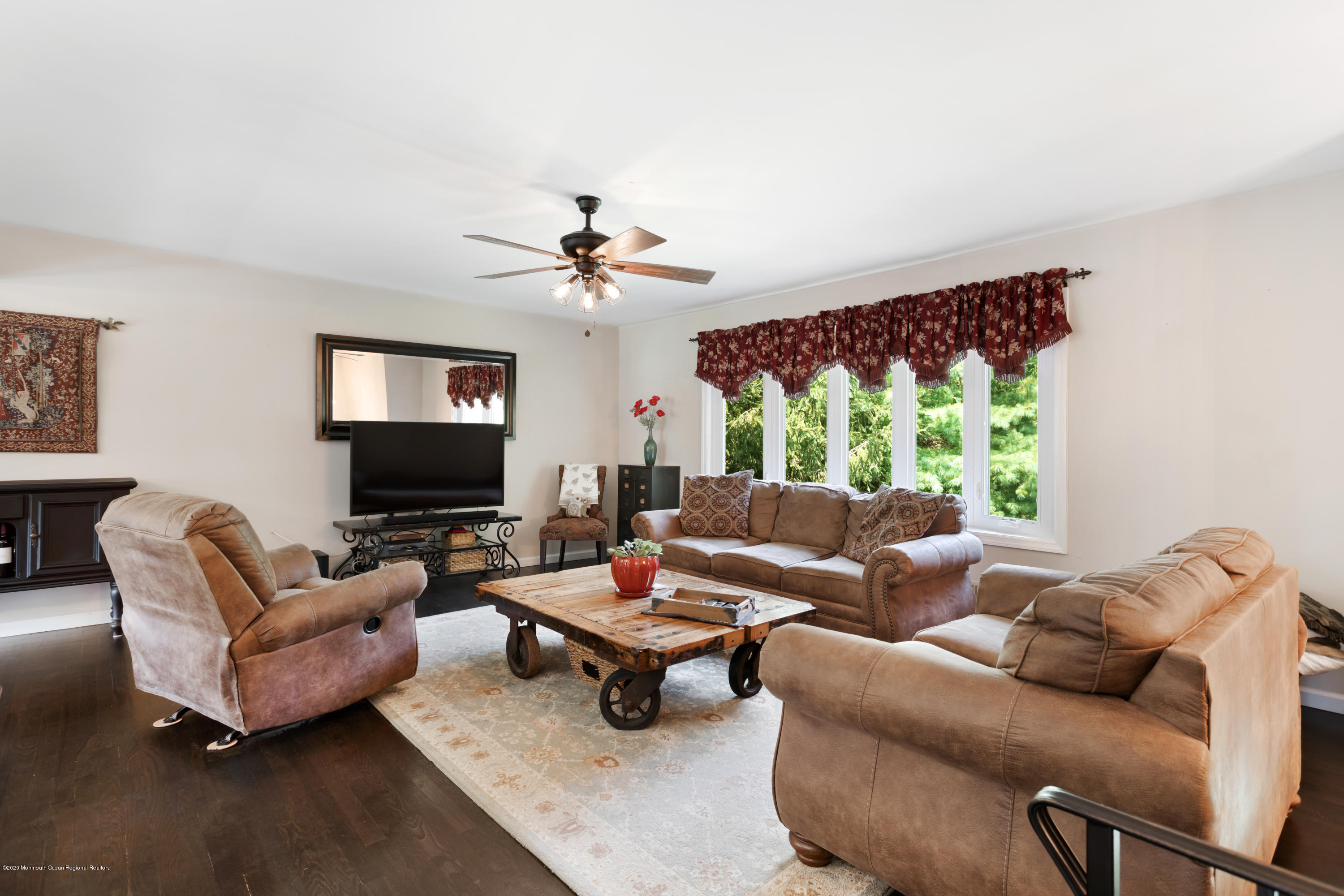 77 East Pleasant Grove Road Jackson, NJ 08527 - Photo 3 of 29 a living room with furniture and a flat screen tv