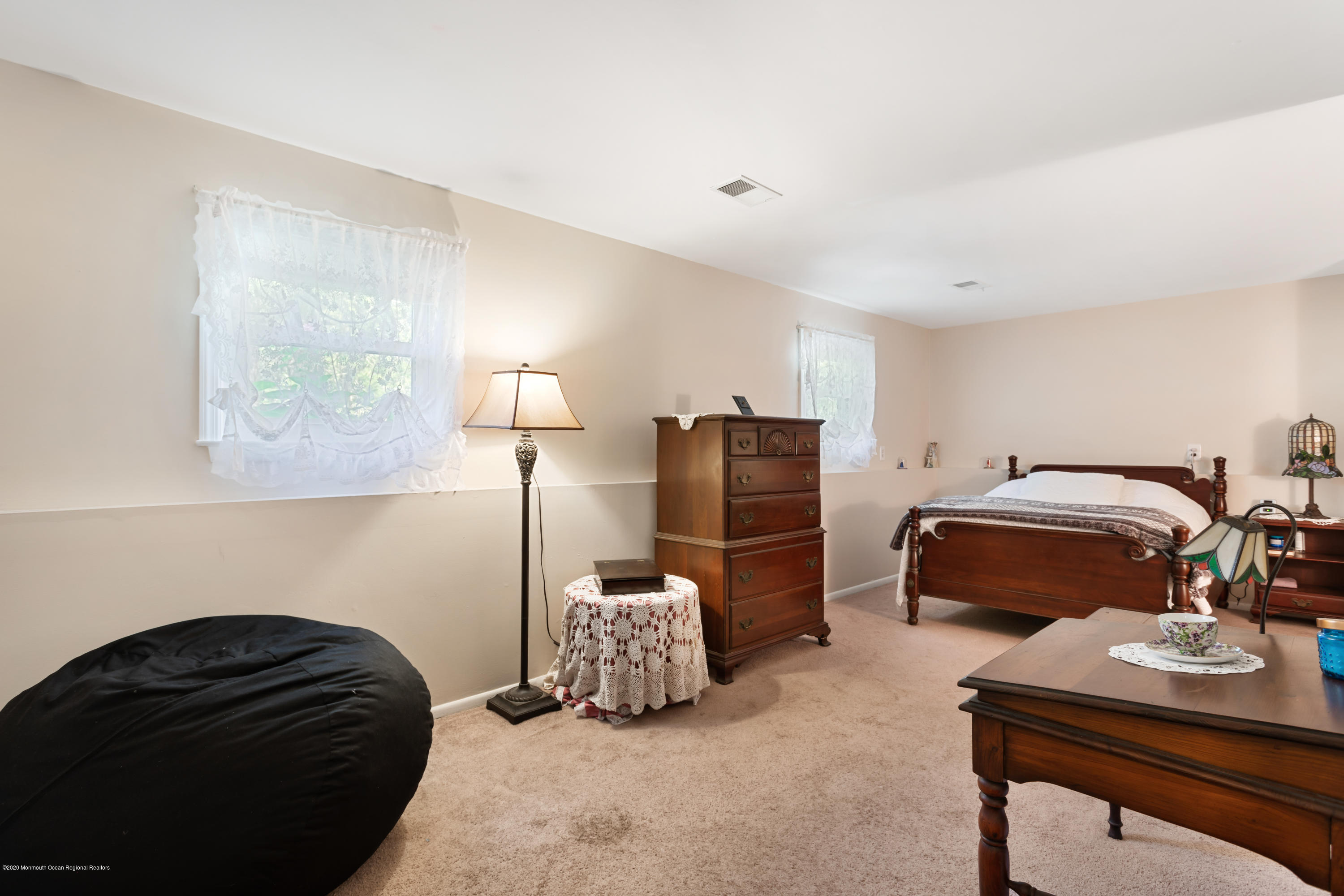 77 East Pleasant Grove Road Jackson, NJ 08527 - Photo 21 of 29 a bedroom with a bed and a lamp