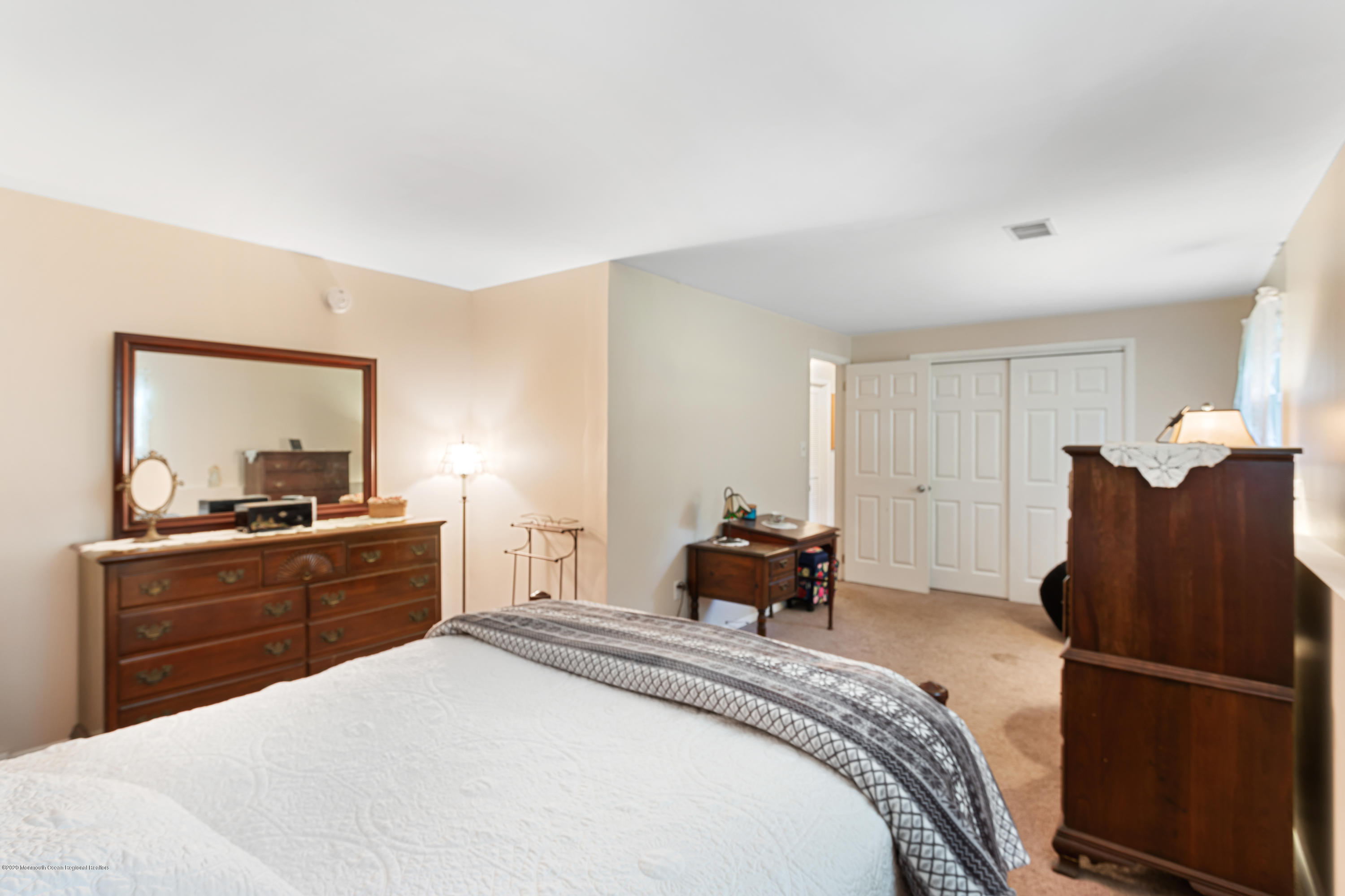 77 East Pleasant Grove Road Jackson, NJ 08527 - Photo 22 of 29 a bedroom with a bed and furniture