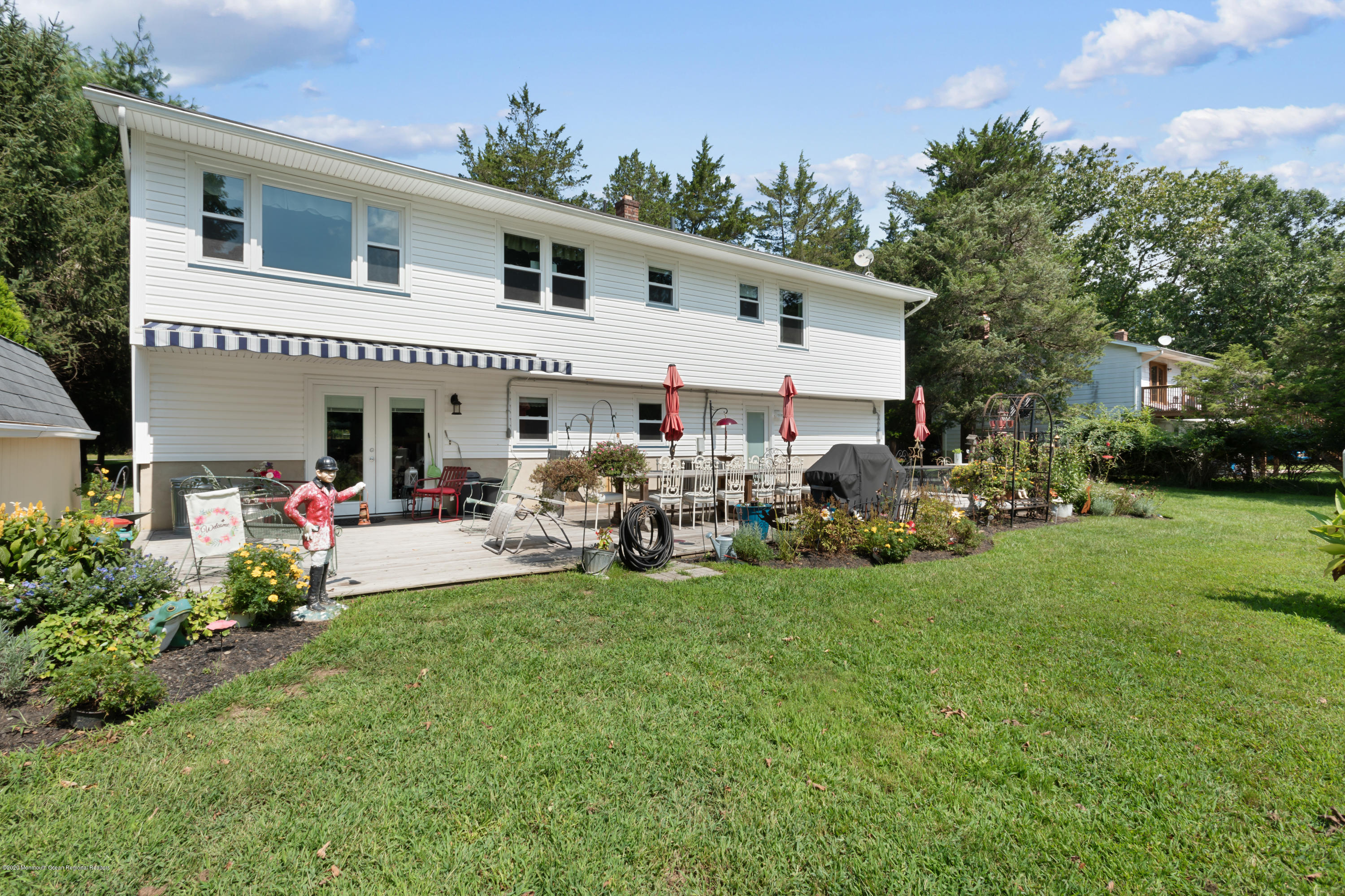 77 East Pleasant Grove Road Jackson, NJ 08527 - Photo 26 of 29 a view of a house with backyard and sitting area