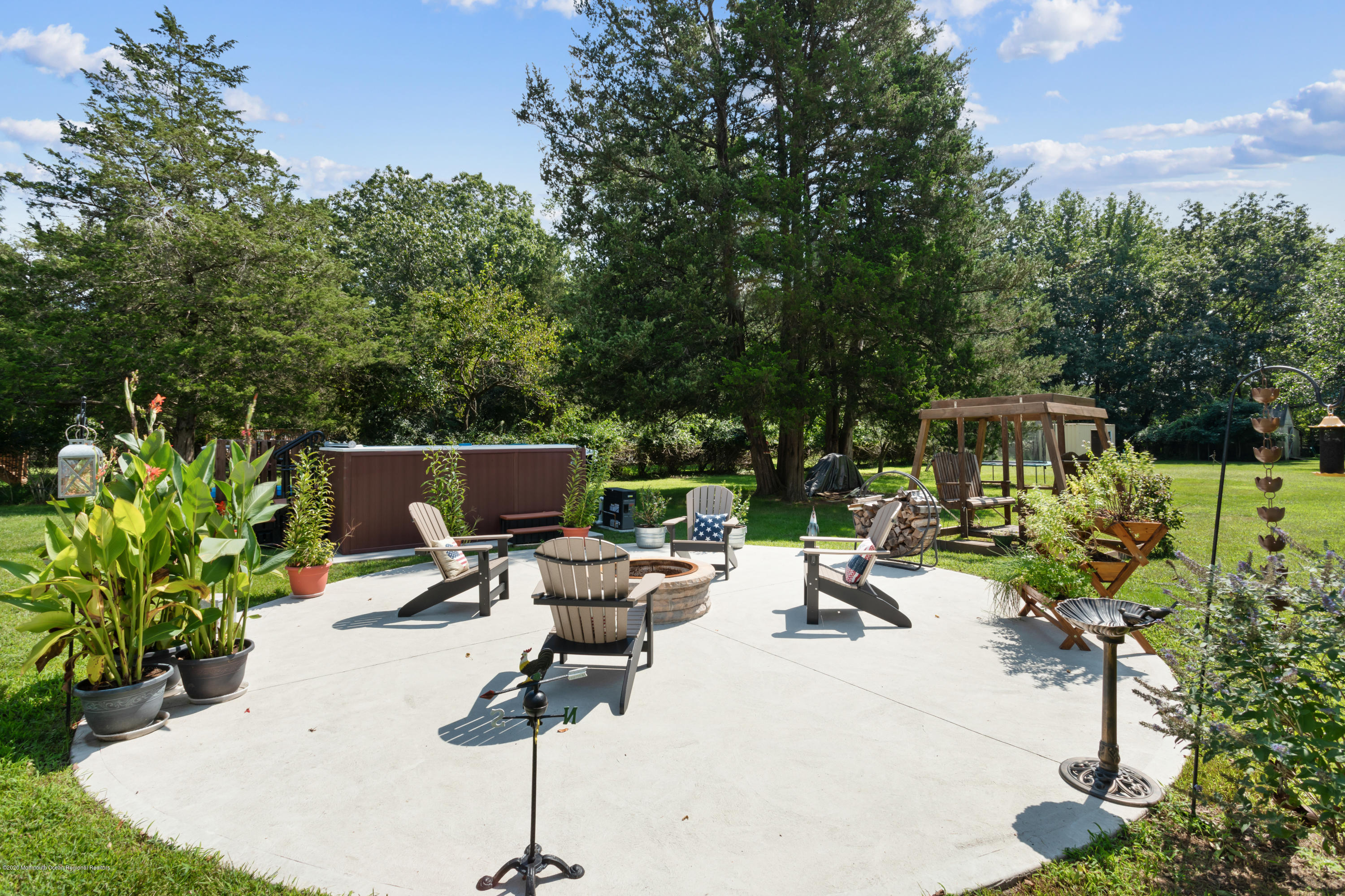 77 East Pleasant Grove Road Jackson, NJ 08527 - Photo 27 of 29 a view of swimming pool with outdoor seating and trees