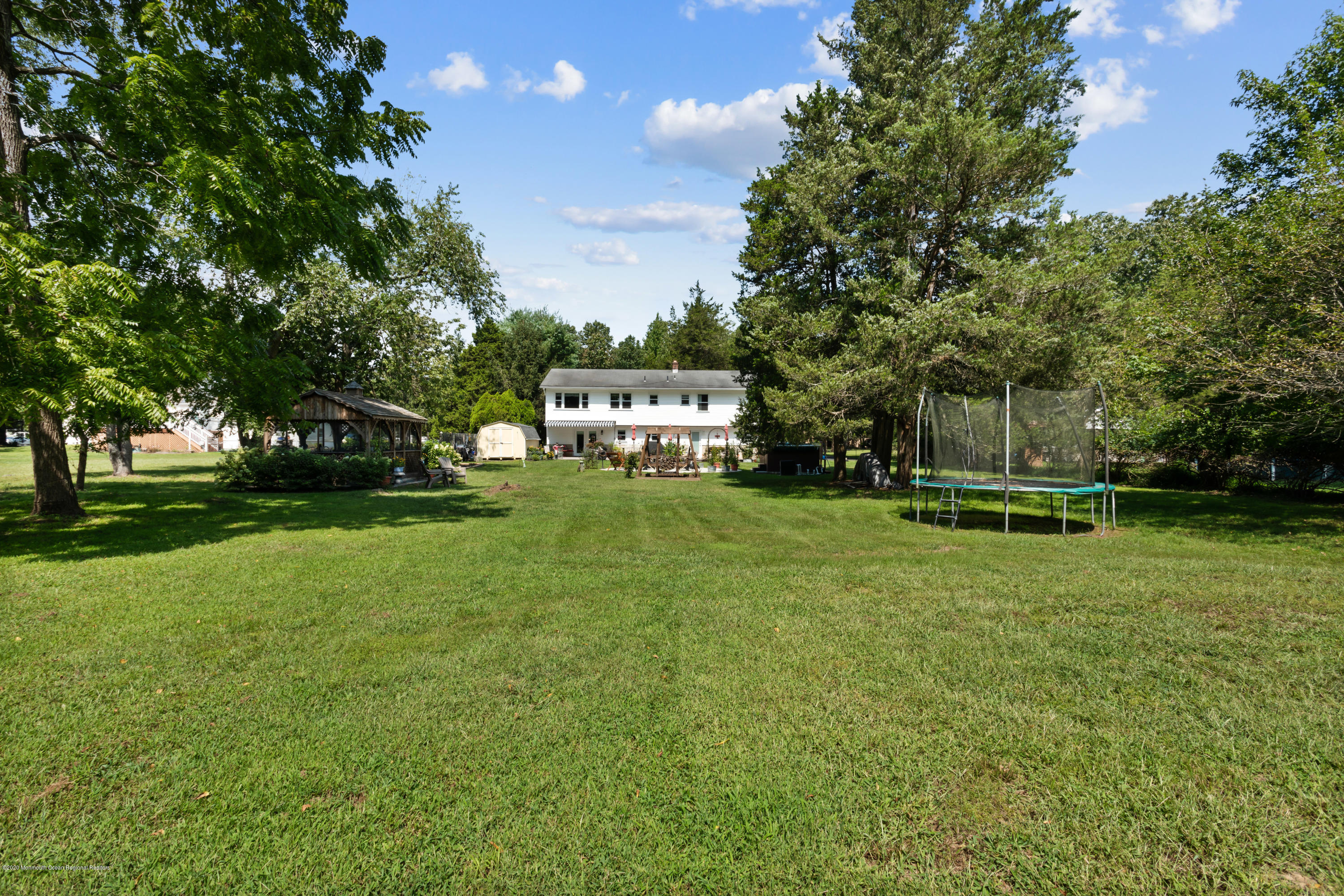 77 East Pleasant Grove Road Jackson, NJ 08527 - Photo 28 of 29 a view of a house with a park