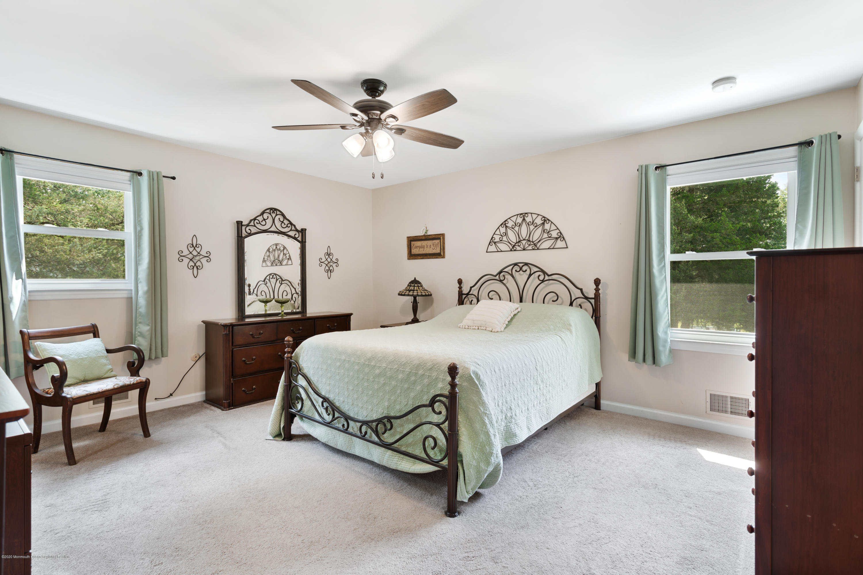 77 East Pleasant Grove Road Jackson, NJ 08527 - Photo 8 of 29 a spacious bedroom with a bed and a chandelier