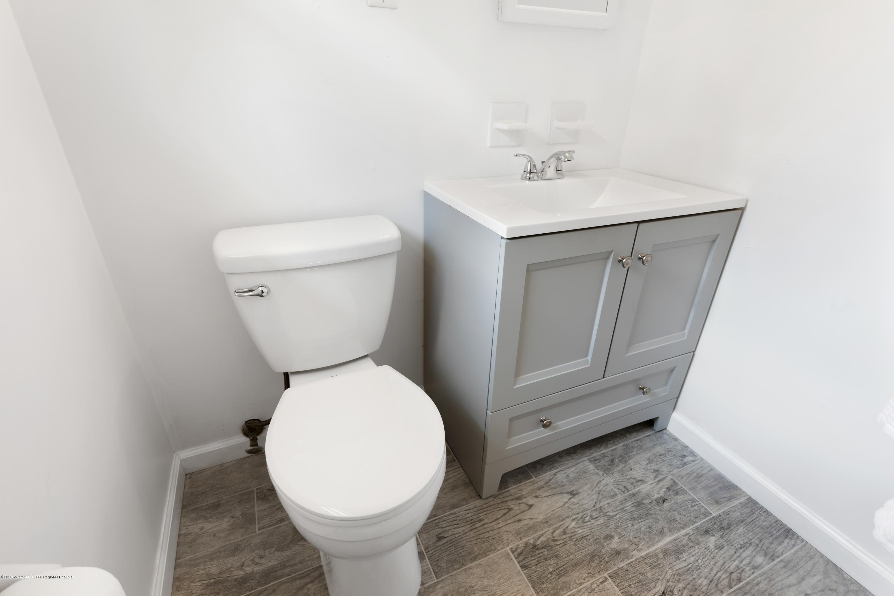 77 East Pleasant Grove Road Jackson, NJ 08527 - Photo 10 of 29 a bathroom with a toilet sink and mirror