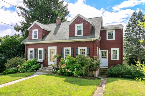57 Emerson Road Needham, MA 02492 - Photo 1 of 19 a front view of a house with yard and green space