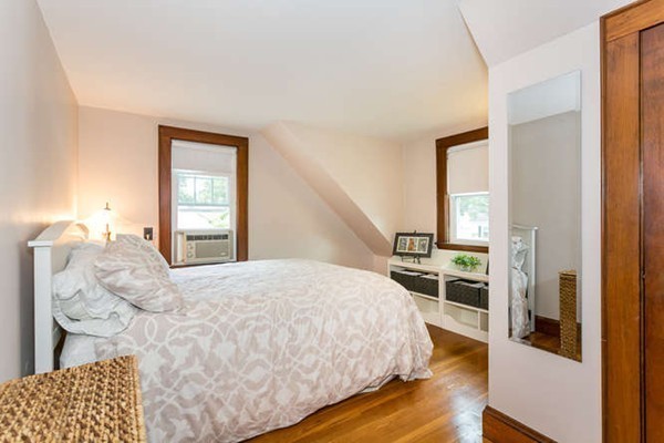57 Emerson Road Needham, MA 02492 - Photo 11 of 19 a bedroom with a bed and a dresser with wooden floor