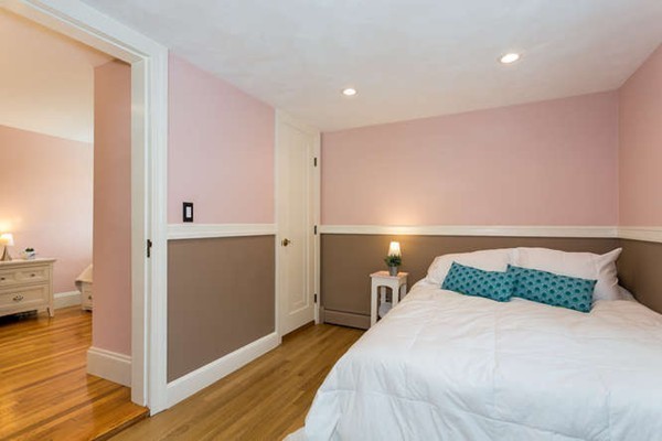 57 Emerson Road Needham, MA 02492 - Photo 14 of 19 a bedroom with a bed and wooden floor