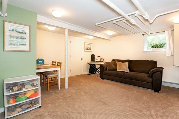 57 Emerson Road Needham, MA 02492 - Photo 15 of 19 a living room with furniture and a window