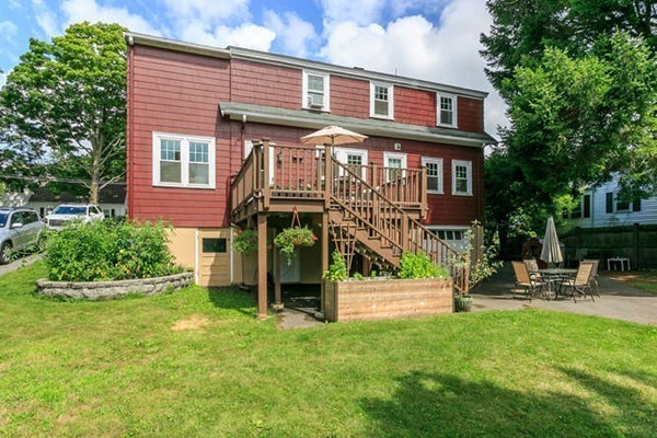 57 Emerson Road Needham, MA 02492 - Photo 17 of 19 a front view of a house with a yard