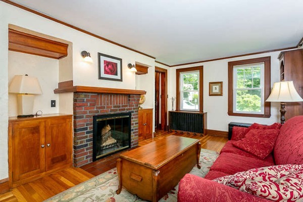 57 Emerson Road Needham, MA 02492 - Photo 3 of 19 a living room with furniture and a fireplace
