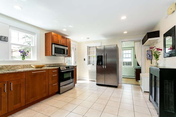 57 Emerson Road Needham, MA 02492 - Photo 5 of 19 a kitchen with stainless steel appliances granite countertop a refrigerator and a stove top oven