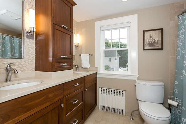 57 Emerson Road Needham, MA 02492 - Photo 9 of 19 a bathroom with a sink a toilet and a window