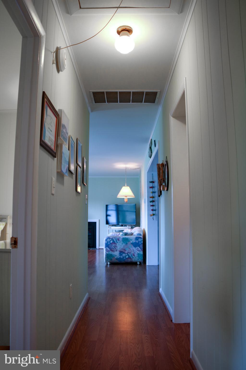 533 Harbor Road Ocean View, DE 19970 - Photo 20 of 31 Hallway with pull down steps to attic