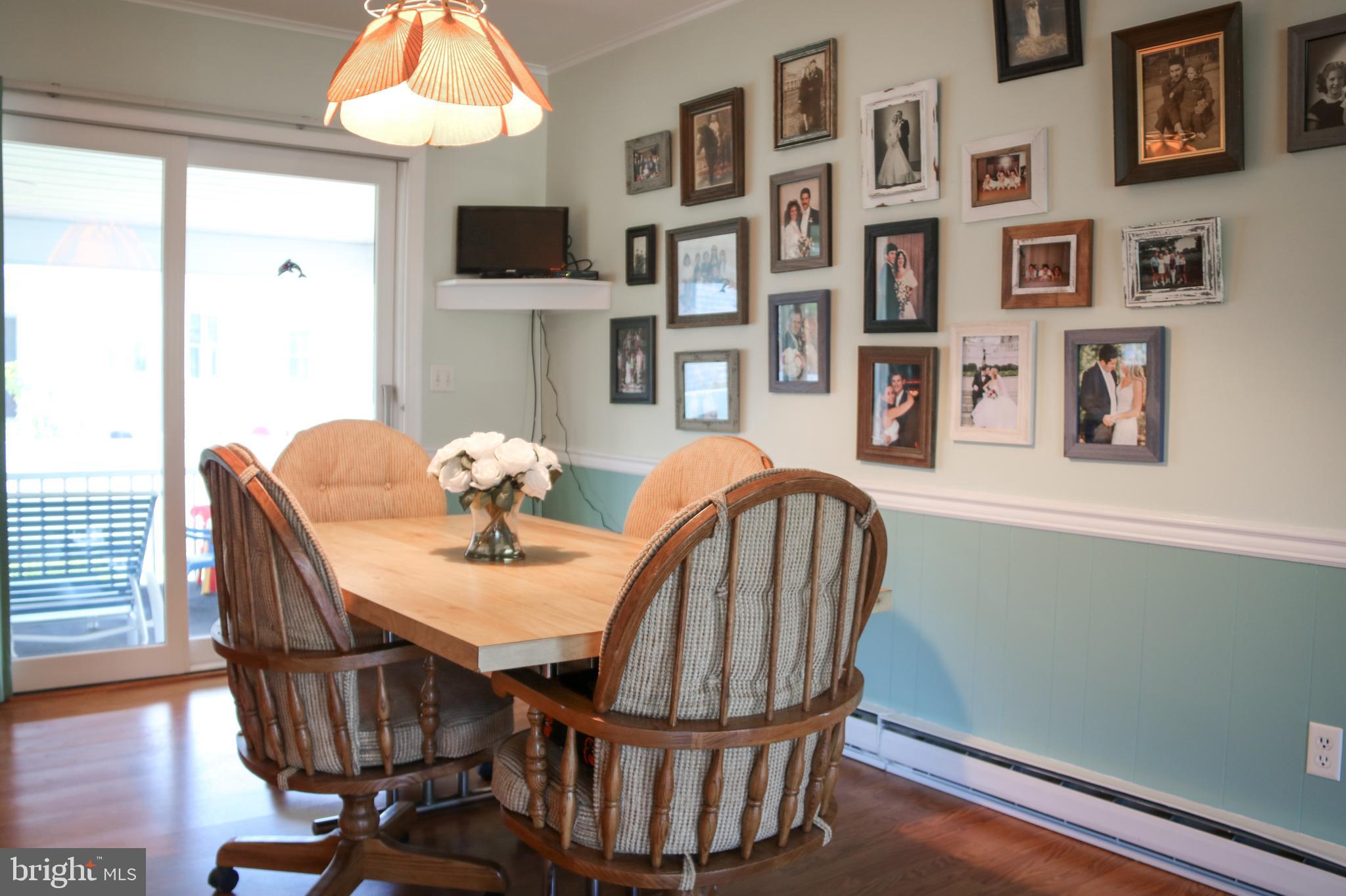 533 Harbor Road Ocean View, DE 19970 - Photo 9 of 31 Dining area with sliders to screened in porch