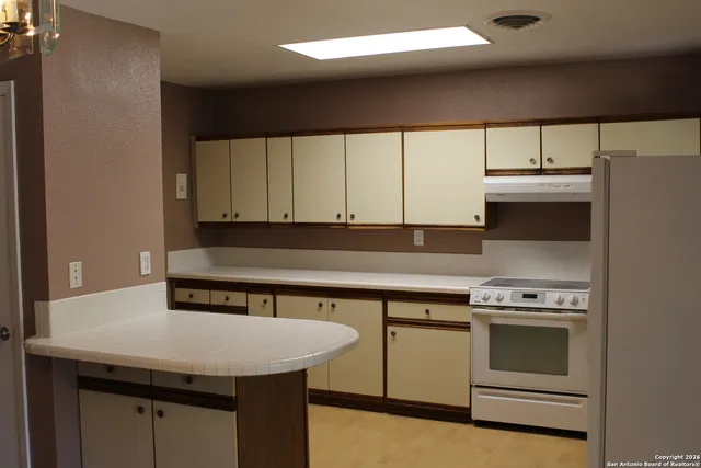 a kitchen with a stove and a sink