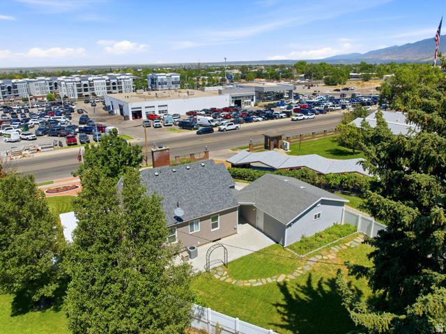 1925 South Main Street Bountiful, UT 84010 - Photo 40 of 48 Aerial perspective highlighting the property with a gray shingle roof, light gray siding, and a detached garage