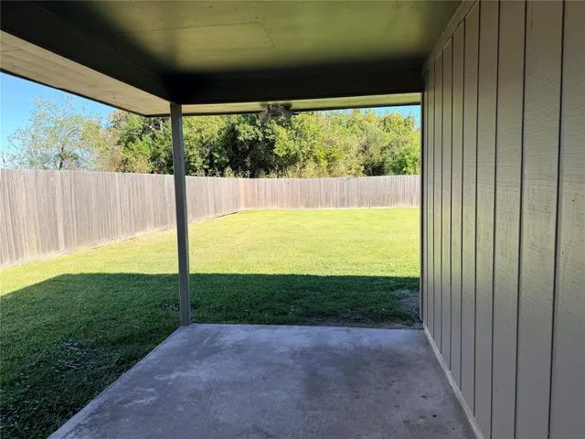 a view of a back yard from a room