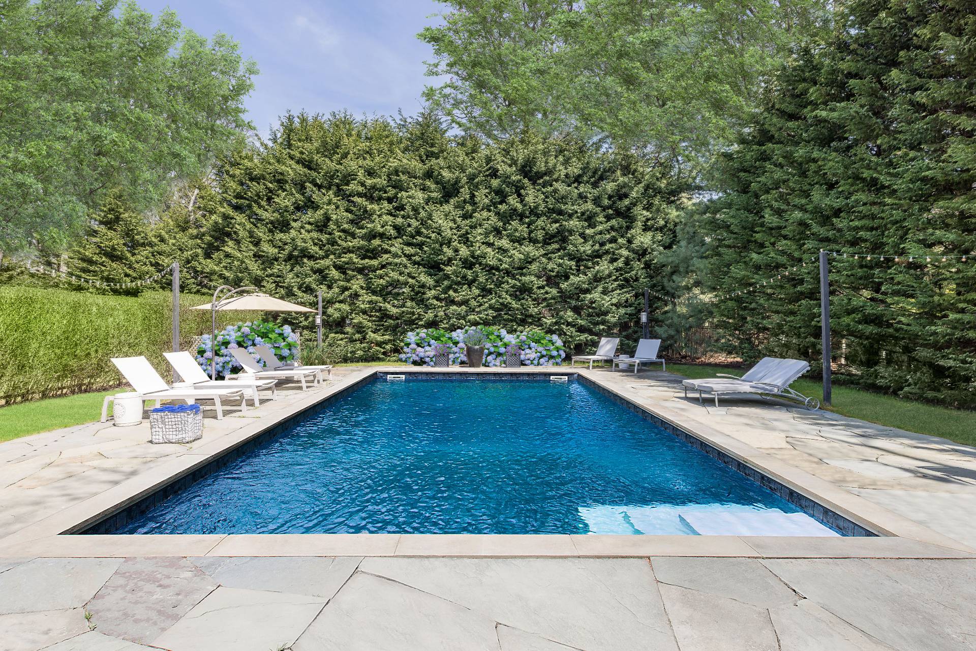 8 Centre Way East Hampton, NY 11937 - Photo 13 of 17 a view of a backyard with a patio