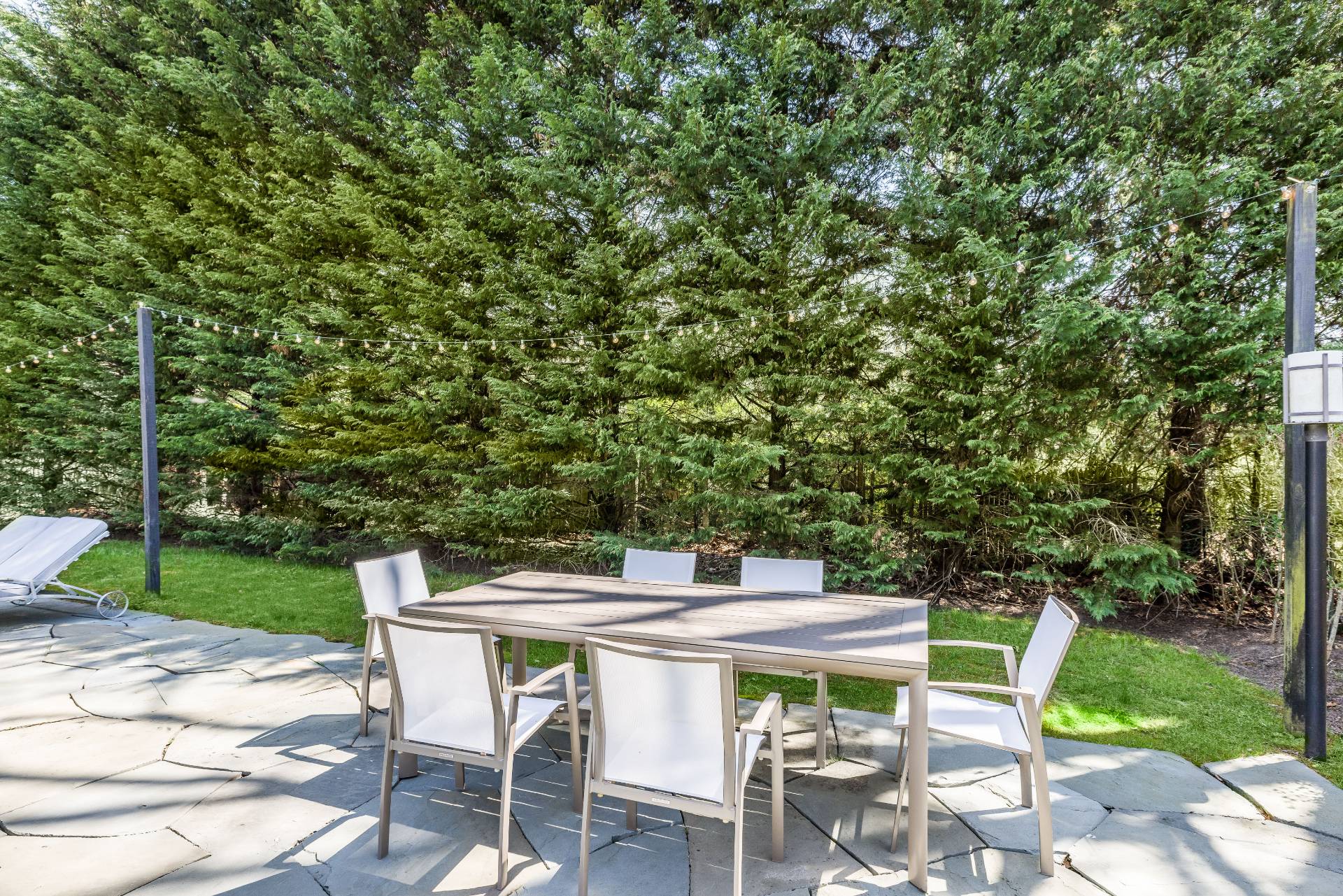 8 Centre Way East Hampton, NY 11937 - Photo 14 of 17 a patio with table and chairs