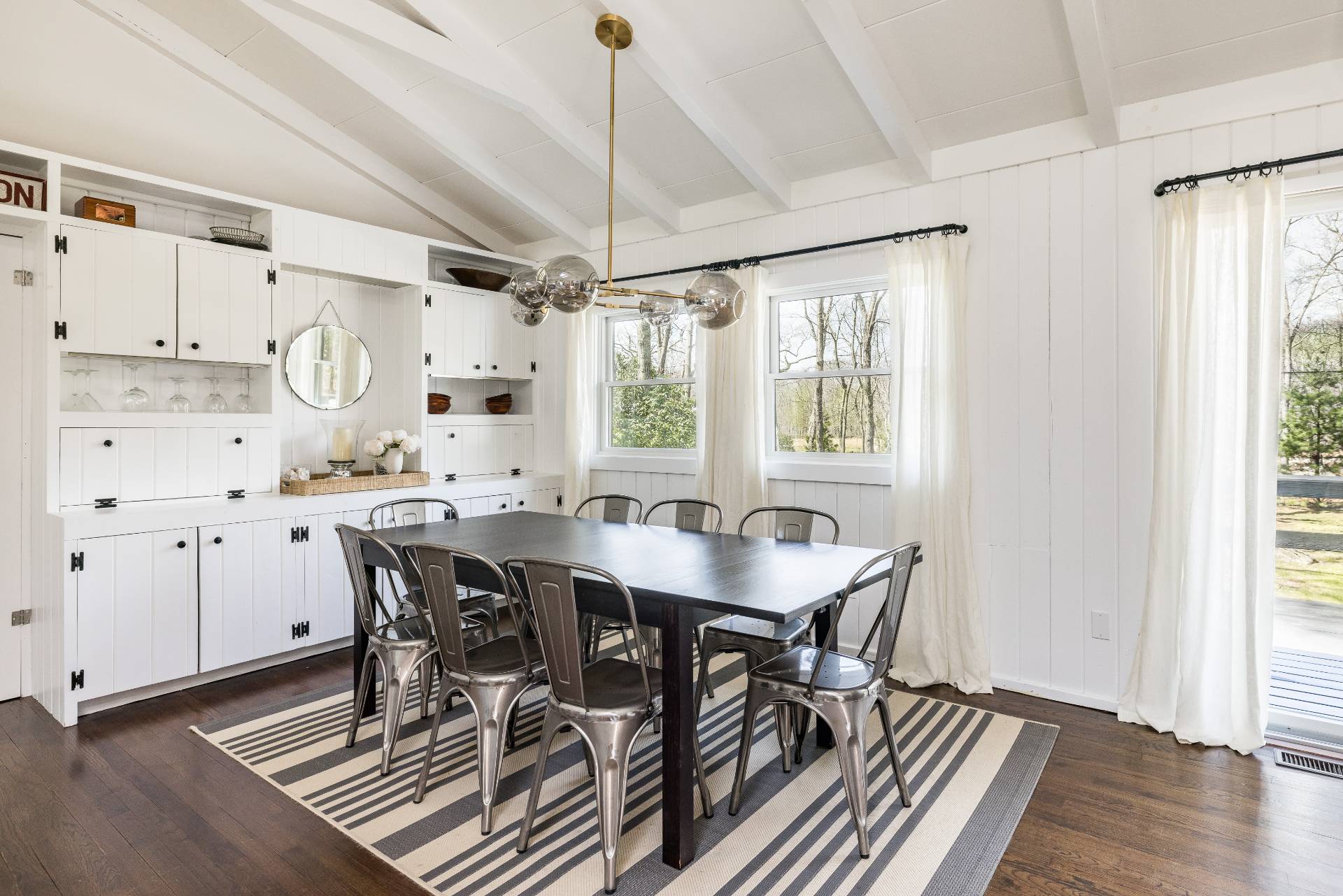 8 Centre Way East Hampton, NY 11937 - Photo 6 of 17 a view of a dining room with furniture window and wooden floor