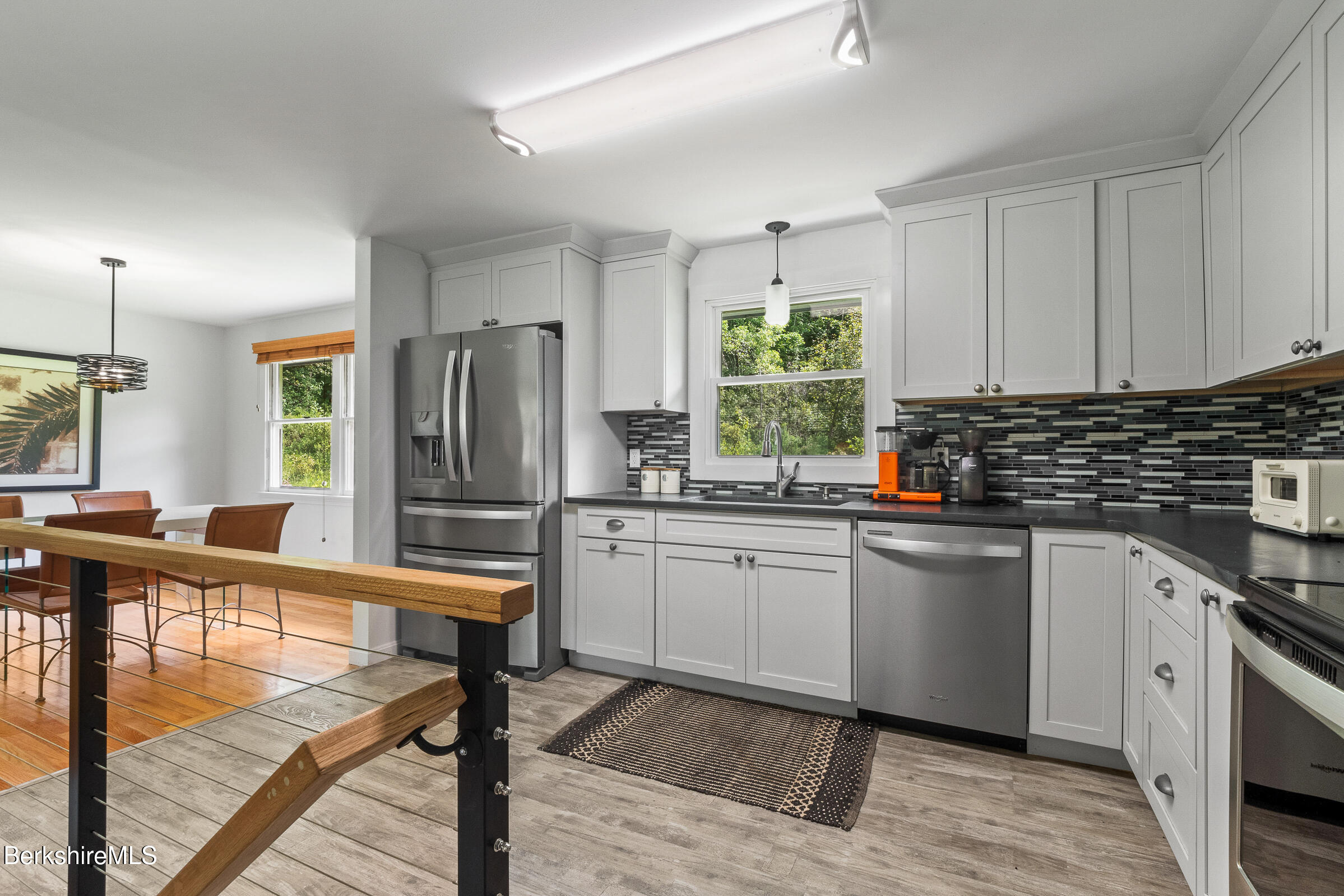 308 Lenox Road Richmond, MA 01254 - Photo 13 of 28 a kitchen with stainless steel appliances granite countertop a stove a sink dishwasher a refrigerator and white cabinets with wooden floor