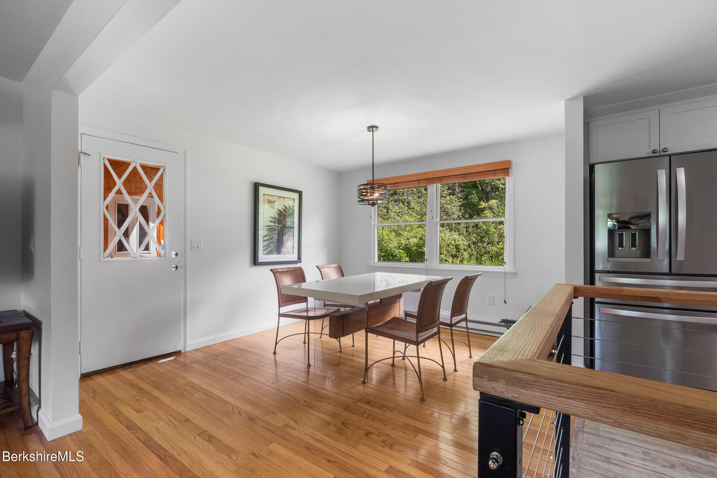 308 Lenox Road Richmond, MA 01254 - Photo 14 of 28 a view of a dining room with furniture window and wooden floor
