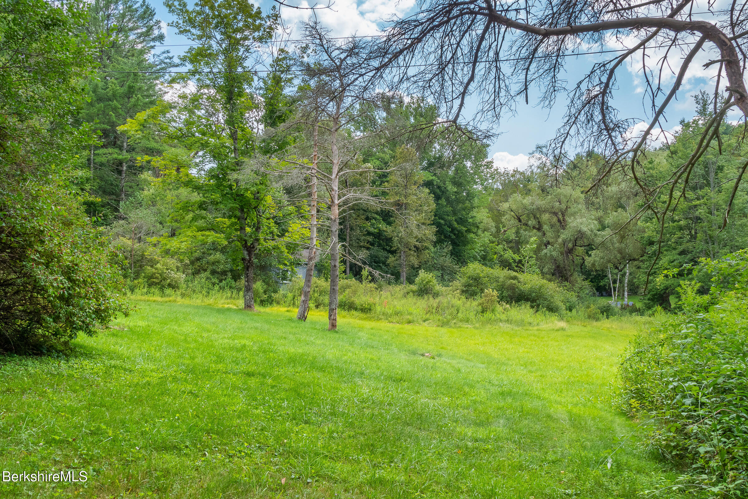 308 Lenox Road Richmond, MA 01254 - Photo 26 of 28 a view of field with trees in the background