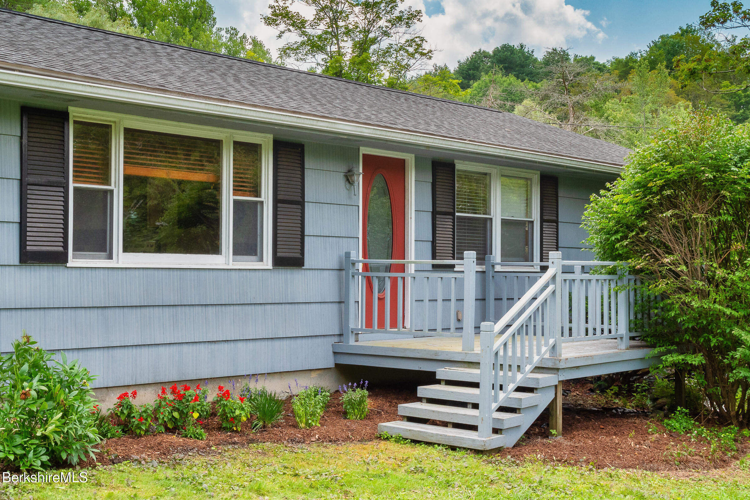 308 Lenox Road Richmond, MA 01254 - Photo 3 of 28 a front view of a house with a garden