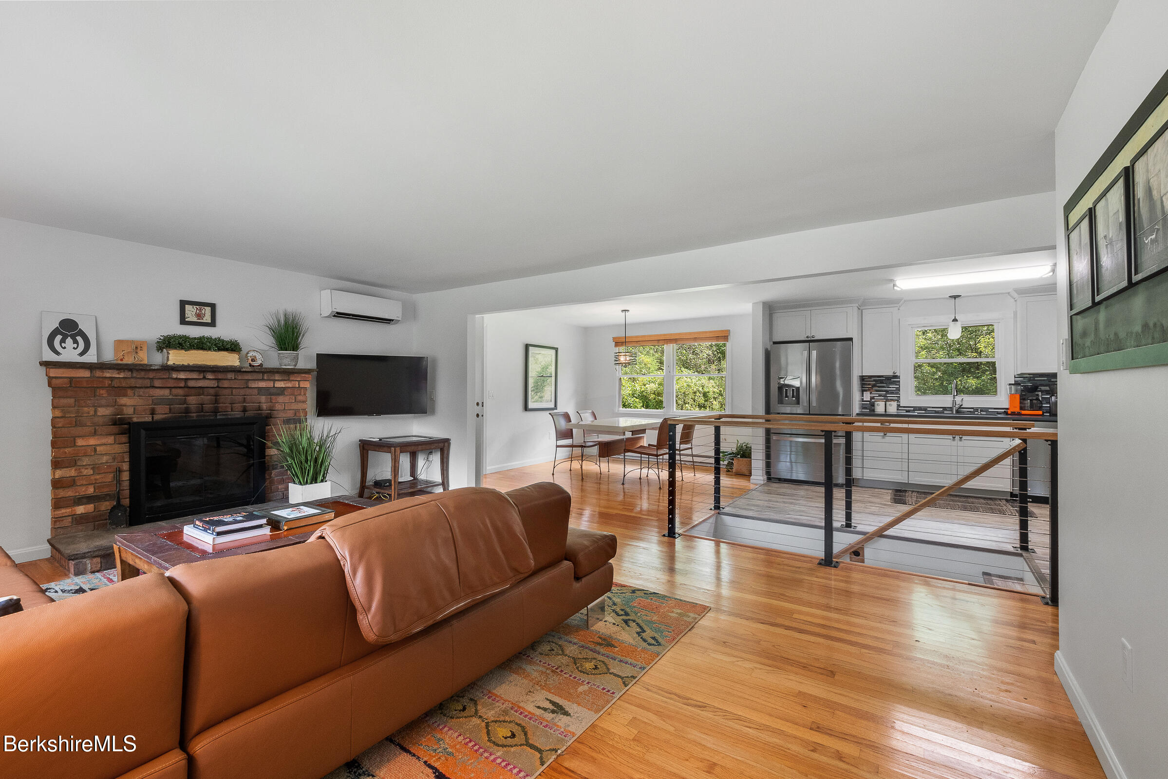308 Lenox Road Richmond, MA 01254 - Photo 5 of 28 a living room with furniture a fireplace and a flat screen tv
