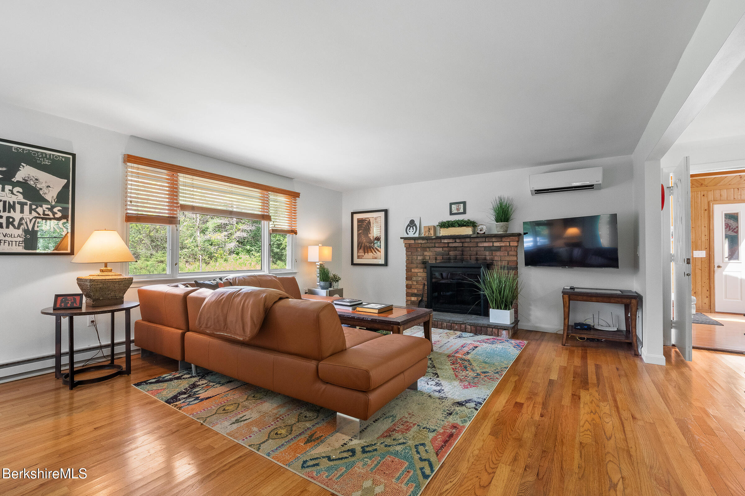 308 Lenox Road Richmond, MA 01254 - Photo 6 of 28 a living room with furniture and a fireplace
