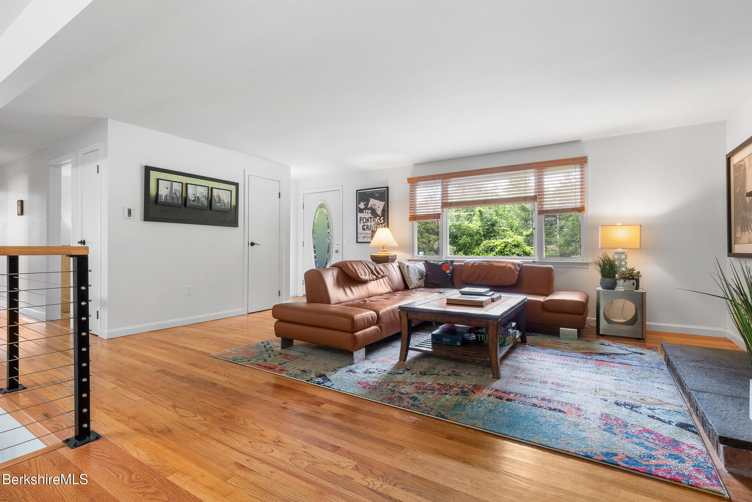 308 Lenox Road Richmond, MA 01254 - Photo 10 of 28 a living room with furniture wooden floor and a large window