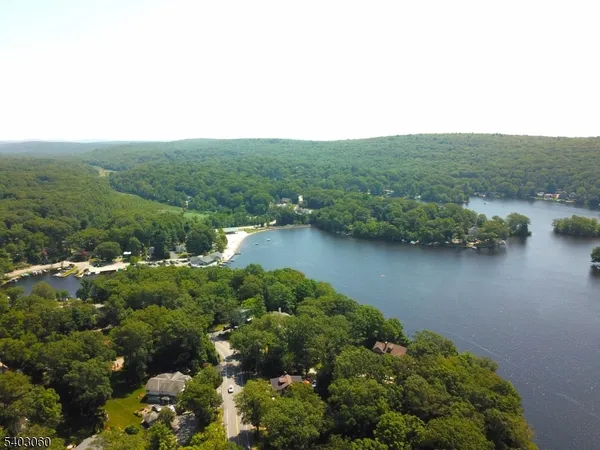 a view of a lake with green space