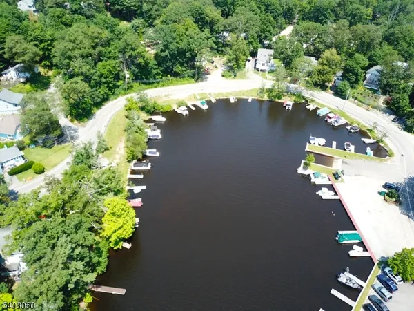 an aerial view of a house with yard swimming pool and outdoor seating