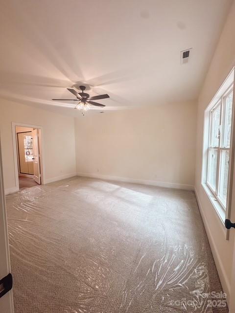 720 McLarty Street Monroe, NC 28112 - Photo 12 of 14 a view of a livingroom with a ceiling fan and window