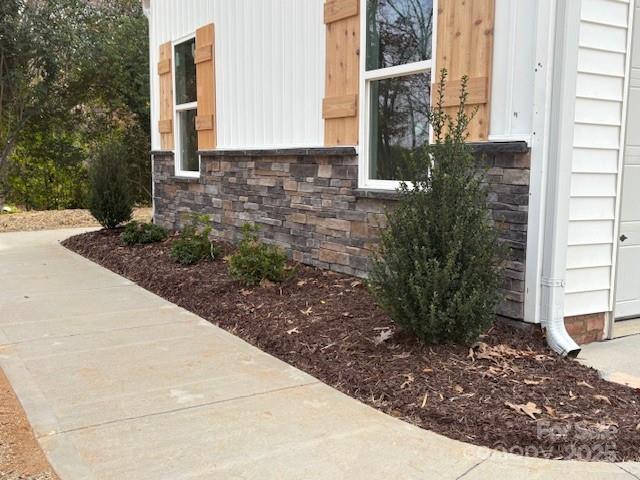 720 McLarty Street Monroe, NC 28112 - Photo 3 of 14 a view of a pathway along the house