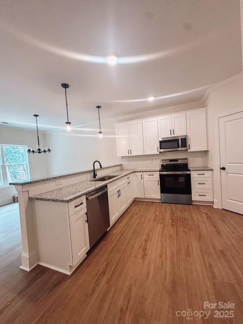 720 McLarty Street Monroe, NC 28112 - Photo 7 of 14 a kitchen with granite countertop a stove top oven and cabinets