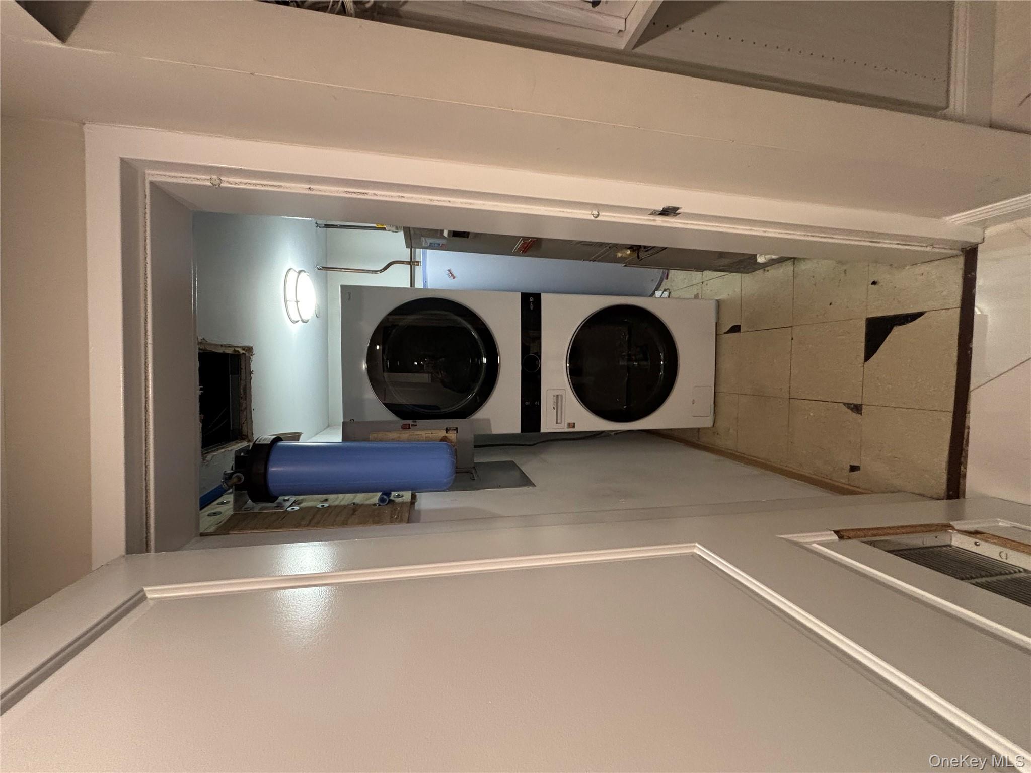 100 Cutter Mill Road, Unit 1B Great Neck, NY 11021 - Photo 11 of 16 a utility room with dryer and washer