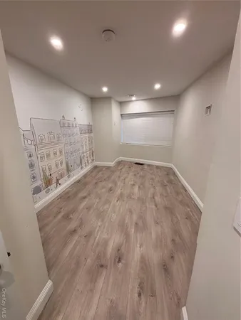 a bathroom with a sink vanity mirror and toilet