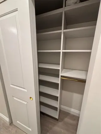a view of an empty walk in closet