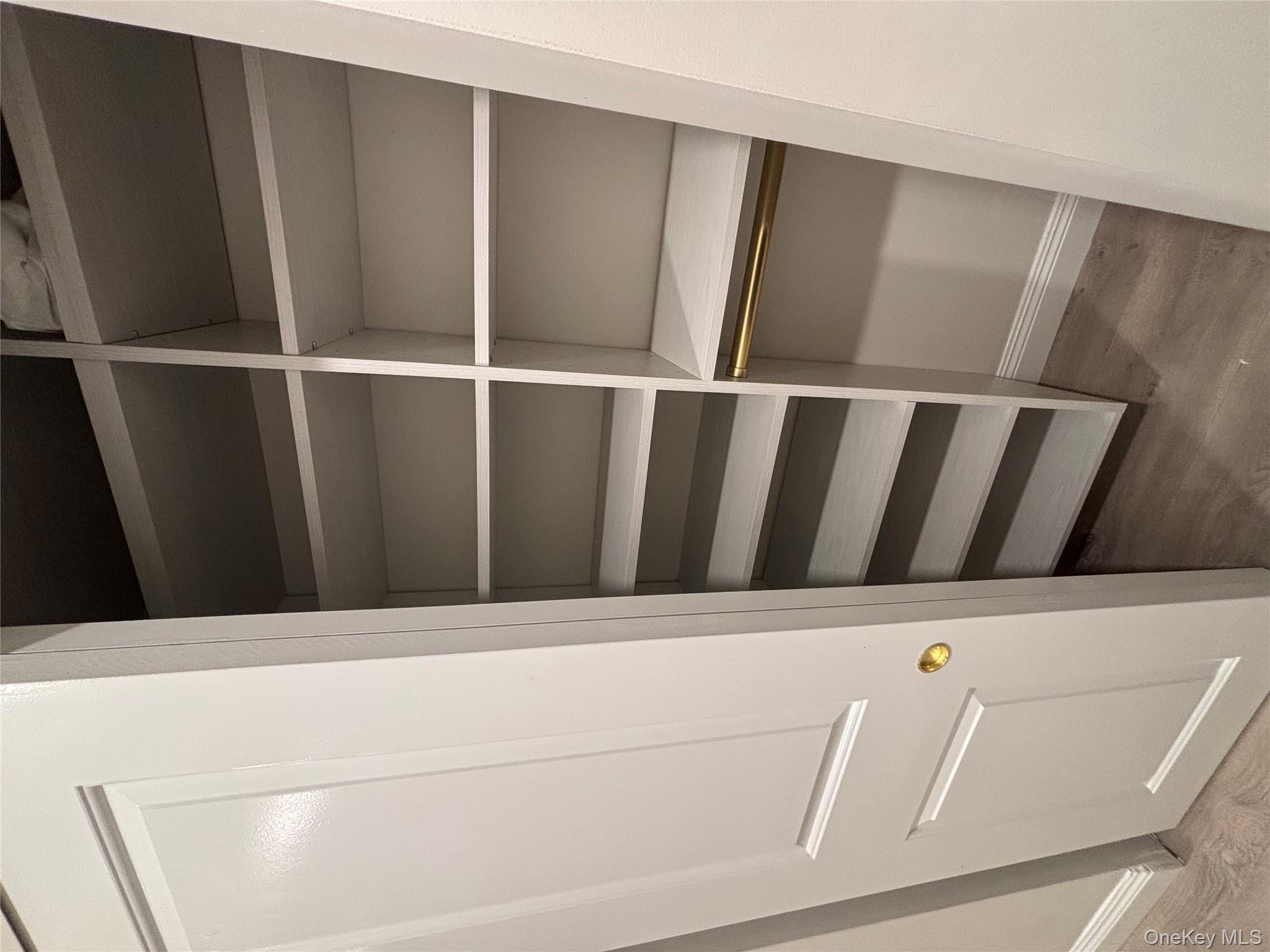 100 Cutter Mill Road, Unit 1B Great Neck, NY 11021 - Photo 7 of 16 a view of walk in closet with empty racks