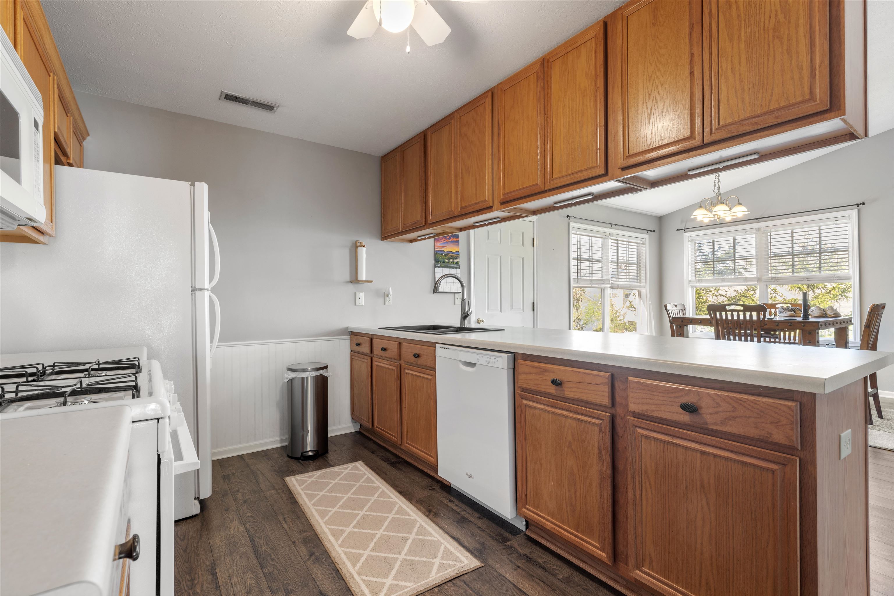 12000 Primrose Place Poplar Grove, IL 61065 - Photo 6 of 15 a kitchen with cabinets appliances a sink and a counter top space