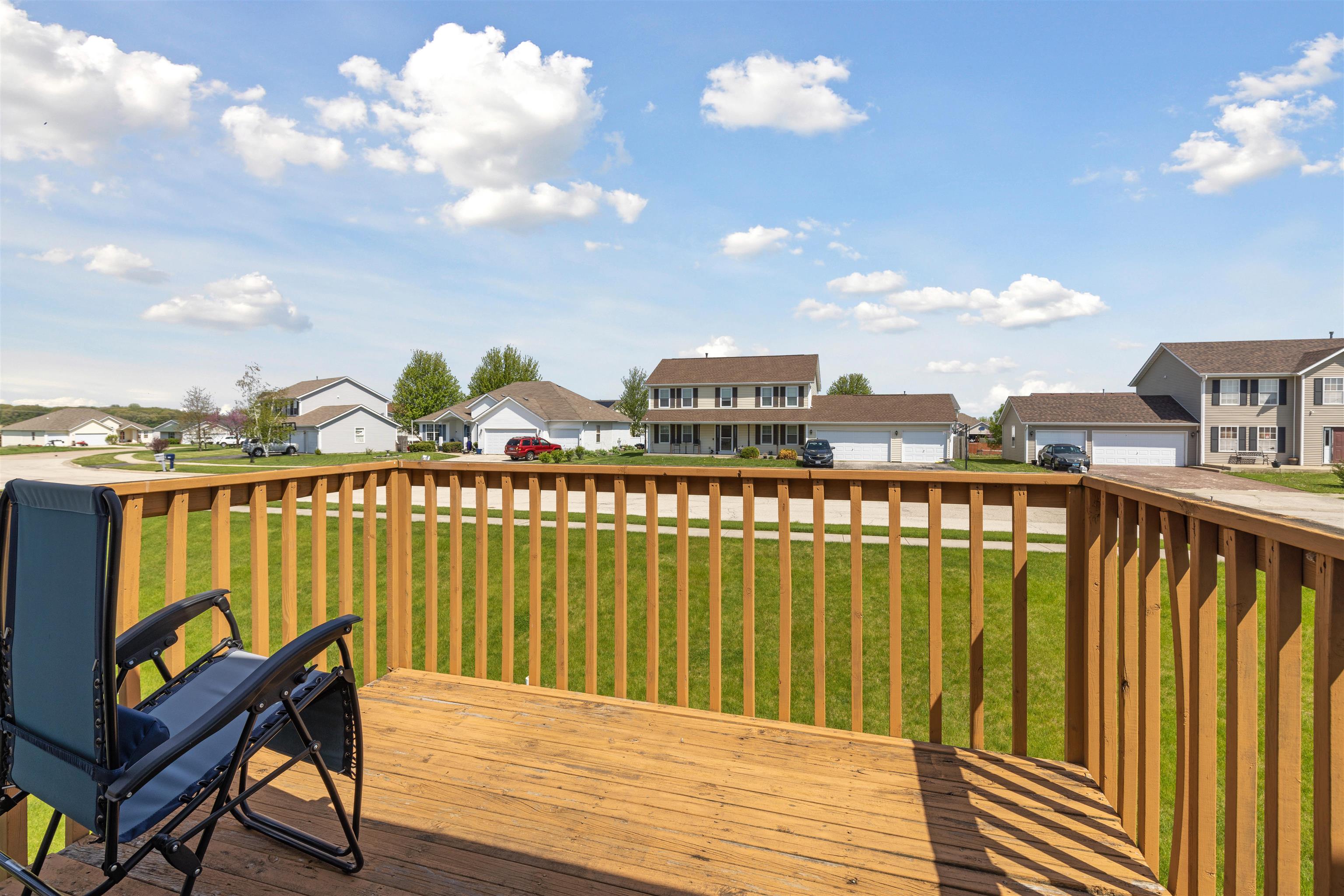 12000 Primrose Place Poplar Grove, IL 61065 - Photo 7 of 15 a view of a balcony with wooden chairs