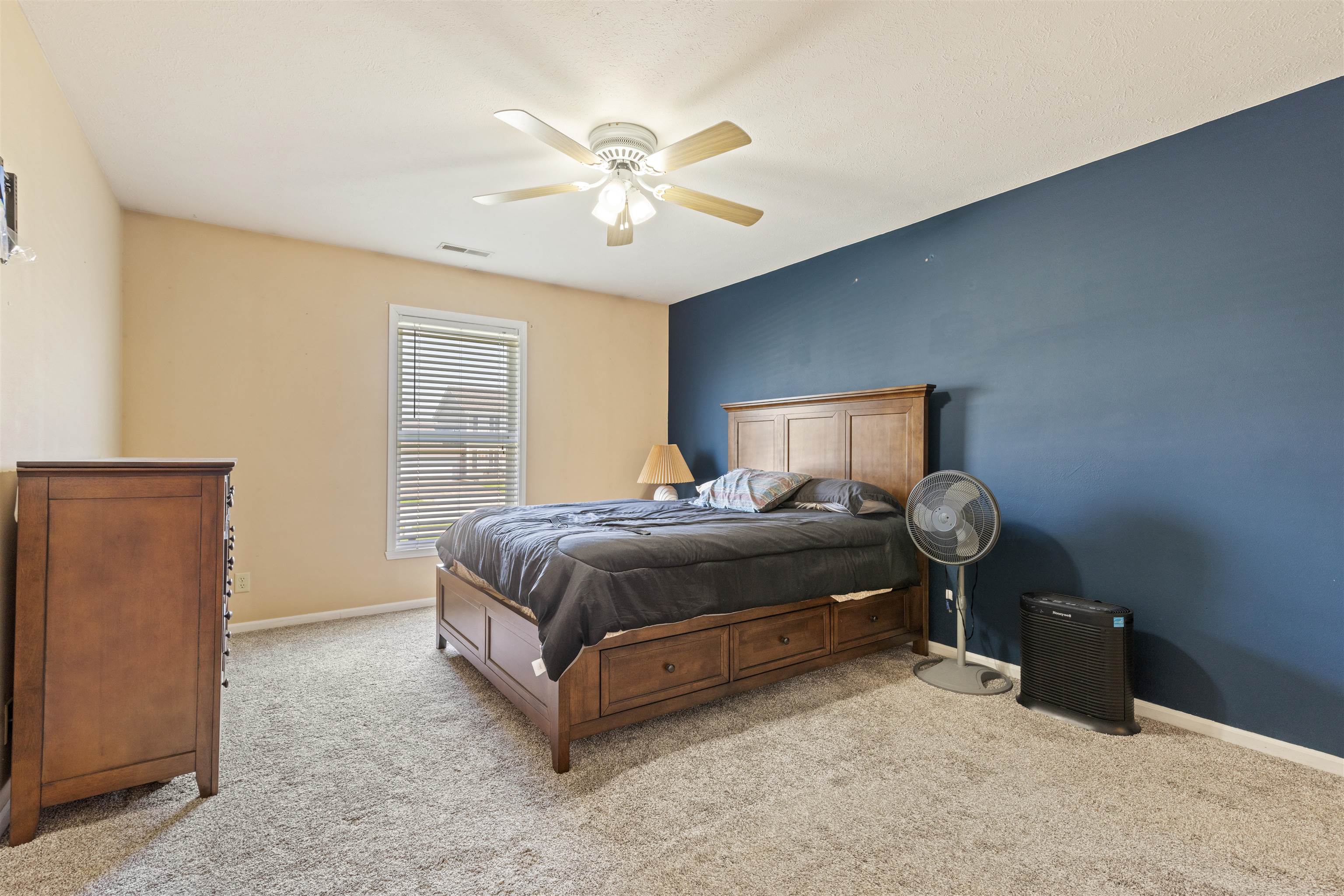 12000 Primrose Place Poplar Grove, IL 61065 - Photo 9 of 15 a bedroom with a bed and a chandelier