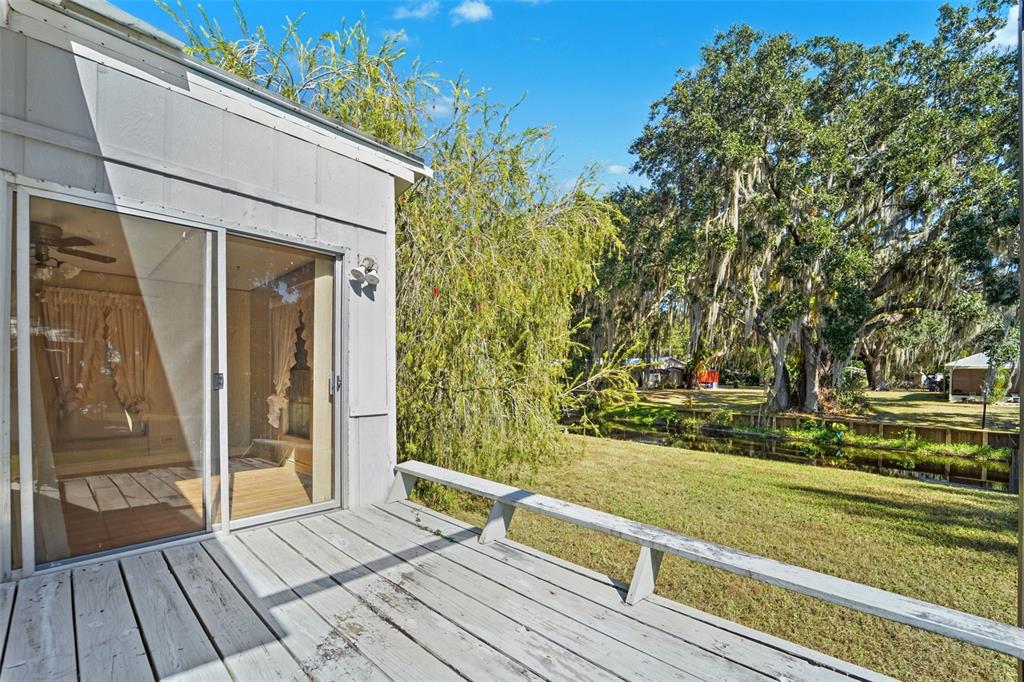 19 Mary Bell Landing Road Sebring, FL 33876 - Photo 17 of 22 a view of backyard with tub and trees in the background