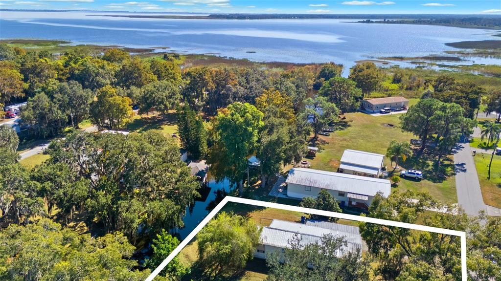 19 Mary Bell Landing Road Sebring, FL 33876 - Photo 21 of 22 a view of a lake with a house in the background
