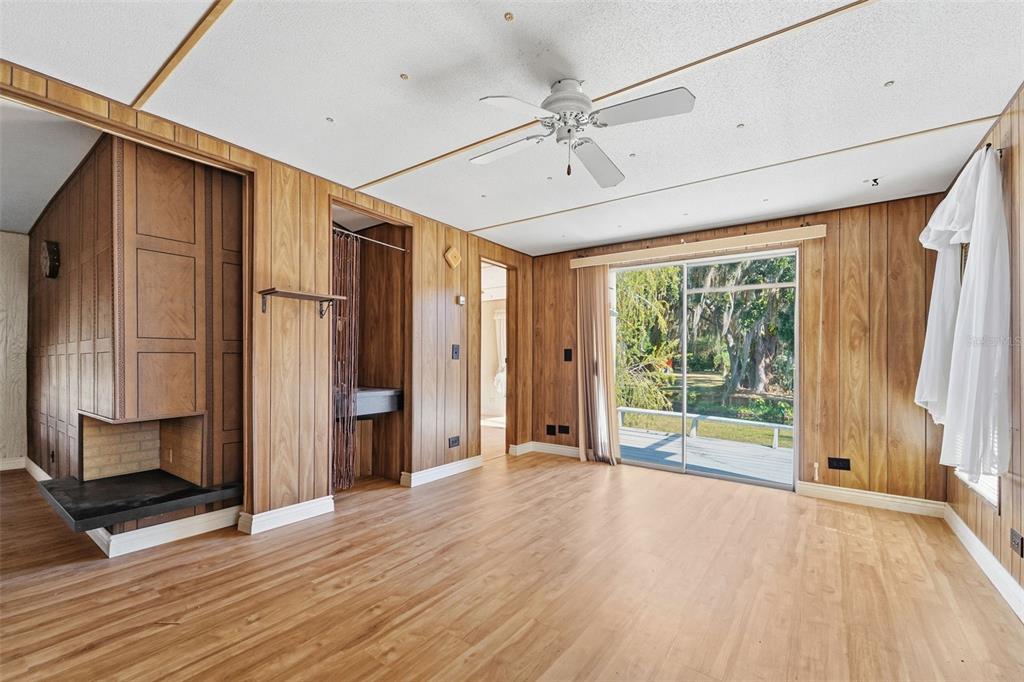 19 Mary Bell Landing Road Sebring, FL 33876 - Photo 6 of 22 a view of empty room with wooden floor and fan