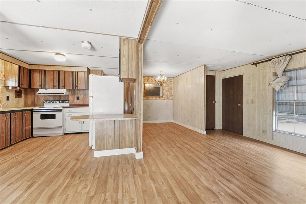 19 Mary Bell Landing Road Sebring, FL 33876 - Photo 8 of 22 a view of kitchen with cabinets and wooden floor