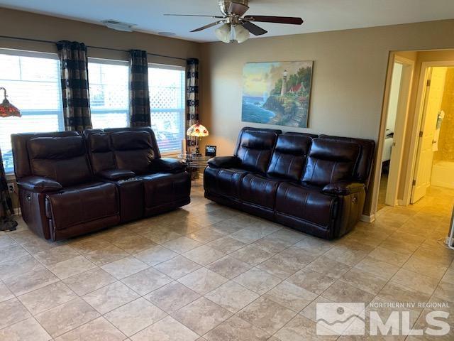 8920 Yeager Street Reno, NV 89506 - Photo 5 of 21 a living room with furniture and a window